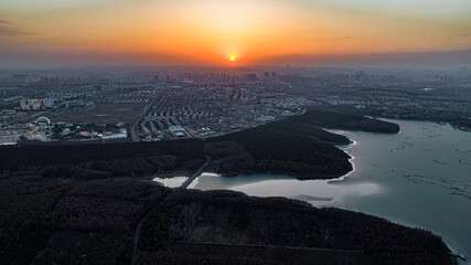 The landscape of Jingyuetan National Forest Park in Changchun, China, where ice melts and snow melts in early spring