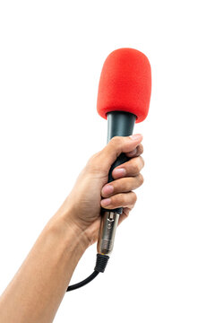 Man hand holding a microphone with red sponge on head isolated on white background.