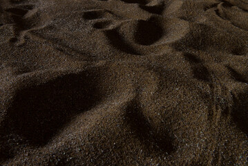A blue and white cake with a cross made of flowers on top