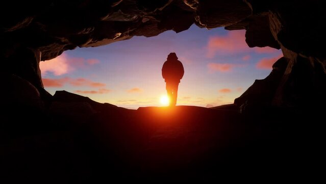 Adventurous Man Hiker Standing In A Cave With Rocky Mountains In Background. Adventure Composite. 3D Rendering Peak. Aerial Image Of Landscape. Sunset Cloudy Sky