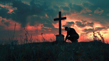 Concept of a man kneeling and praying in front of a cross.