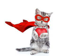 Tabby kitten wearing superhero costume holding red heart and looking away on empty space. Isolated on white background - 784889424