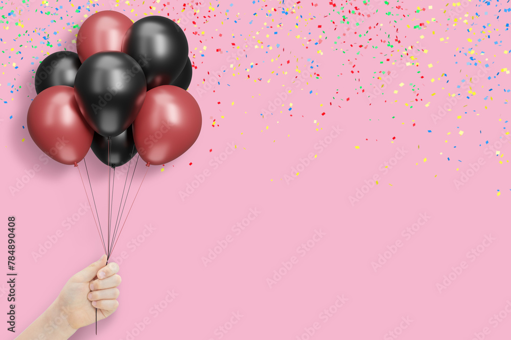 Aufkleber female hand holds bunch of red and black balloons on pink background with confetti. empty space for 