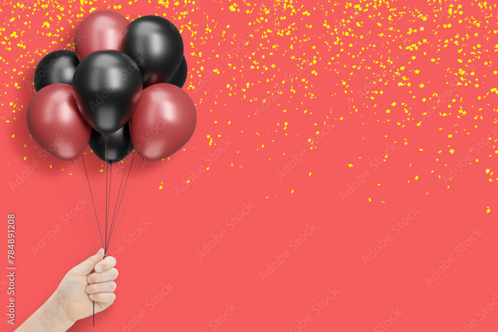 Poster female hand holds bunch of red and black balloons on red background with confetti. empty space for t