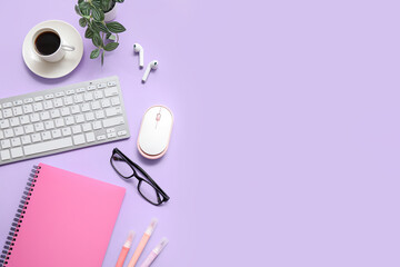 Computer keyboard with mouse, cup of coffee and stationery on purple background