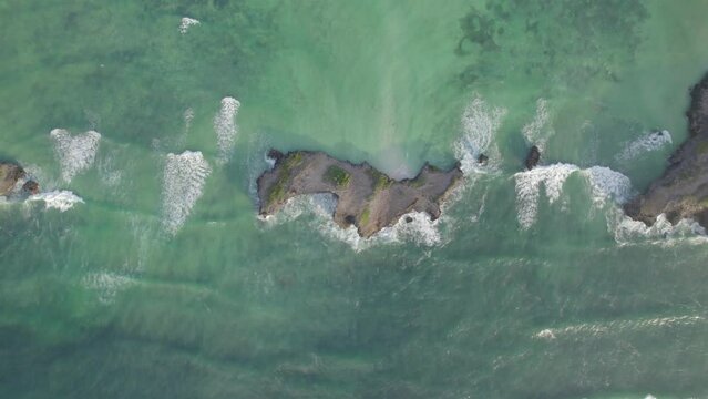 Aerial view of water waves surround Island, Kenyan Coast