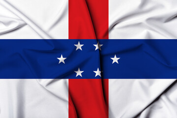 Beautifully waving and striped Netherlands Antilles flag, flag background texture with vibrant...