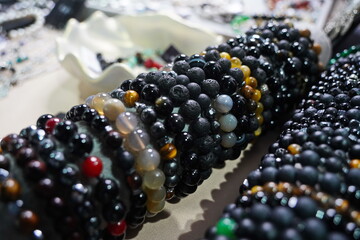 Bracelets made of natural stones: agate, volcanic lava and obsidian.