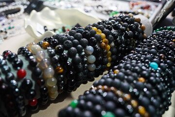 Bracelets made of natural stones: agate, volcanic lava and obsidian.