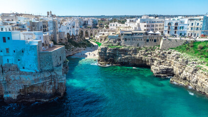 Aerial drone panorama of Polignano a mare, a beautiful city in Puglia, italy, on a sunny day....