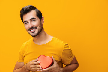 Yellow man concept happy gift love valentine romance heart shape romantic studio portrait