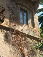 Stone house in the passageway in the old town of Pals under the blue sky in Girona, Spain