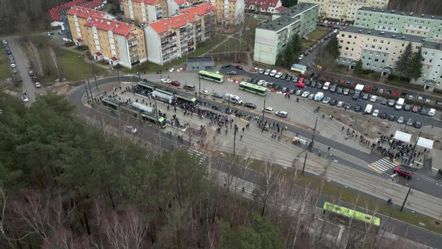 Drone view of a tram loop with a crowd of people