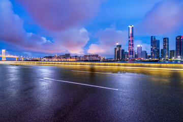 Asphalt highway road and modern city buildings scenery at night in Zhuhai
