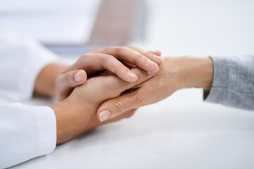 Holding hands, hospital and doctor support with healthcare, wellness and empathy from bad news. Hope, care and pancreas cancer diagnosis in a clinic with patient in a medical consultation for surgery - obrazy, fototapety, plakaty