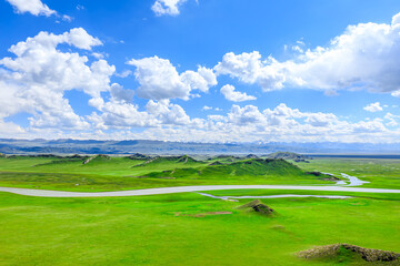 Curved river and green grassland natural landscape in Xinjiang. Summer landscape.