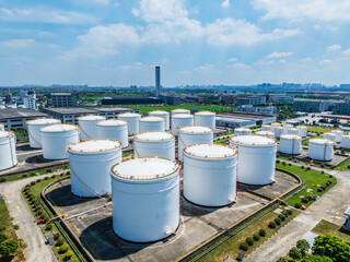 Aerial view of large white Industrial oil tanks. Business fuel and energy.