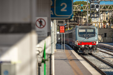 Passenger train arriving to the station of Brindisi in southern Italy, Puglia. Train approaching...