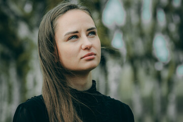 obscured face and the overcast sky contribute to the overall mood, inviting reflection and...