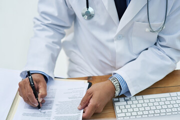 Doctor, writing and hands of notes with working and medical research for pharmaceutical study in office. Person, tech and report information in notebook with hospital paper of healthcare worker
