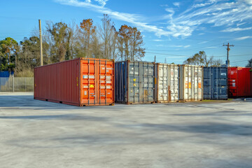 Efficient Storage Solution: Temporary Delivery Containers Set Up in a Vacant Lot—Optimizing Logistics and Storage Space