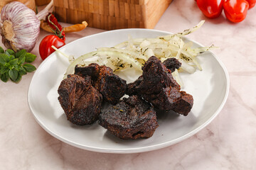 Grilled beef barbecue served onion