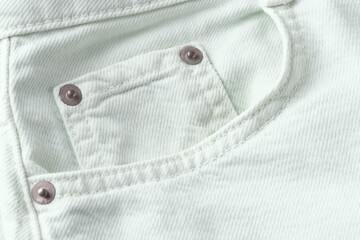 Close up of light mint jeans pocket,pastelt denim cotton fabric texture - 784997421