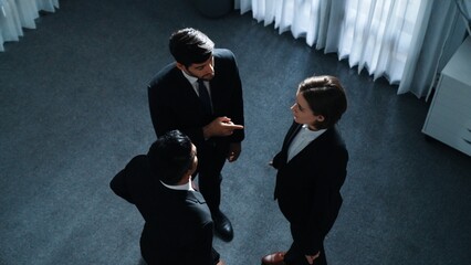 Top view of diverse business team explain marketing strategy while wearing formal suit. Group of smart people brainstorming and discuss plan with caucasian businesswoman at meeting room. Directorate. - obrazy, fototapety, plakaty