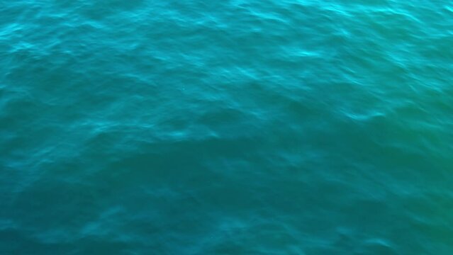 Baltic sea Dark blue clouds and sea or ocean water surface with foam waves before storm, dramatic seascape background. Incredible sunsets. Abstract natural pattern texture.