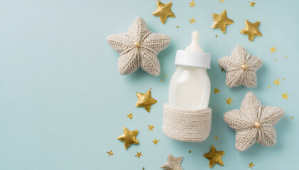 Top view photo of knitted bunny toy milk bottle and gold stars on isolated pastel blue background with copyspace