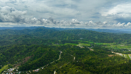 Fototapeta na wymiar Aerial view of sugarcane plantations and agricultural land in the countryside. Negros, Philippines