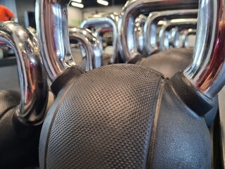 Rows of dumbbells in the gym with hign contrast concept 
