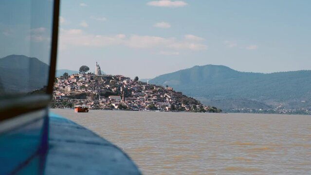 View of Janitzio Island as seen from a boat sailing in Lake Patzcuaro in Michoacan State, Mexico