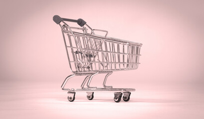 Small shopping cart isolated on solid background - 785040279