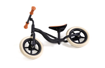 Fototapeta na wymiar Used modern black balace bike for a small child, isolated