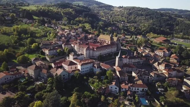 Aerial footage of Ambierle commune on a sunny day in the Loire department in central France