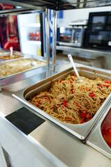 Assorted Dishes Served at a Catered Buffet During a Midday Event