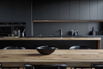 A copy space on a hardwood dining table in a modern black kitchen with kitchen appliances 