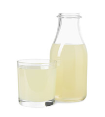 Refreshing lemon juice in bottle and glass isolated on white
