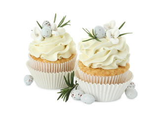Tasty Easter cupcakes with vanilla cream, candies and rosemary isolated on white
