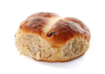 One tasty hot cross bun with raisins isolated on white