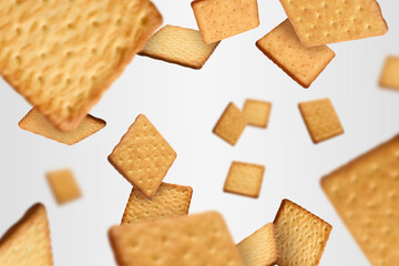 Tasty dry square crackers falling on light grey background