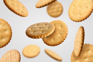 Tasty dry round crackers falling on light grey background