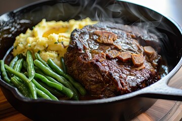 Pot roast in a cast iron dutch oven, green beans and mushed potato