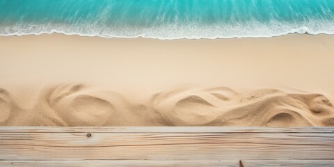 Beach sand and turquoise wooden background with copy space for summer vacation concept, text on the right side