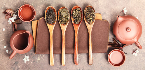Variety of Loose Tea Leaves and Ceramic Tea Set