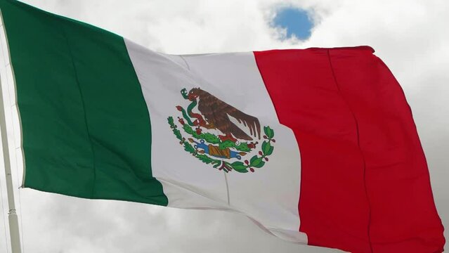 Big real waving Mexican flag moving with the wind in slow motion. Mexico Flag