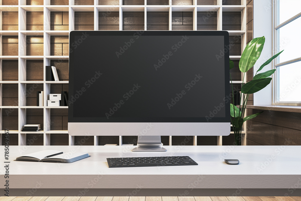 Aufkleber Close up of designer office workplace with empty computer screen, window with city view and wooden shelves in the background. Mock up, 3D Rendering.