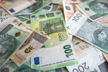 100 euro banknote with 100 200 PLN Polish zloty finance background