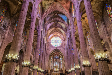 Massive cathedral church nave in Gothik historic old architecture style with domes, archs, columns, chandeliers and oppulent windows breathtaking construction building